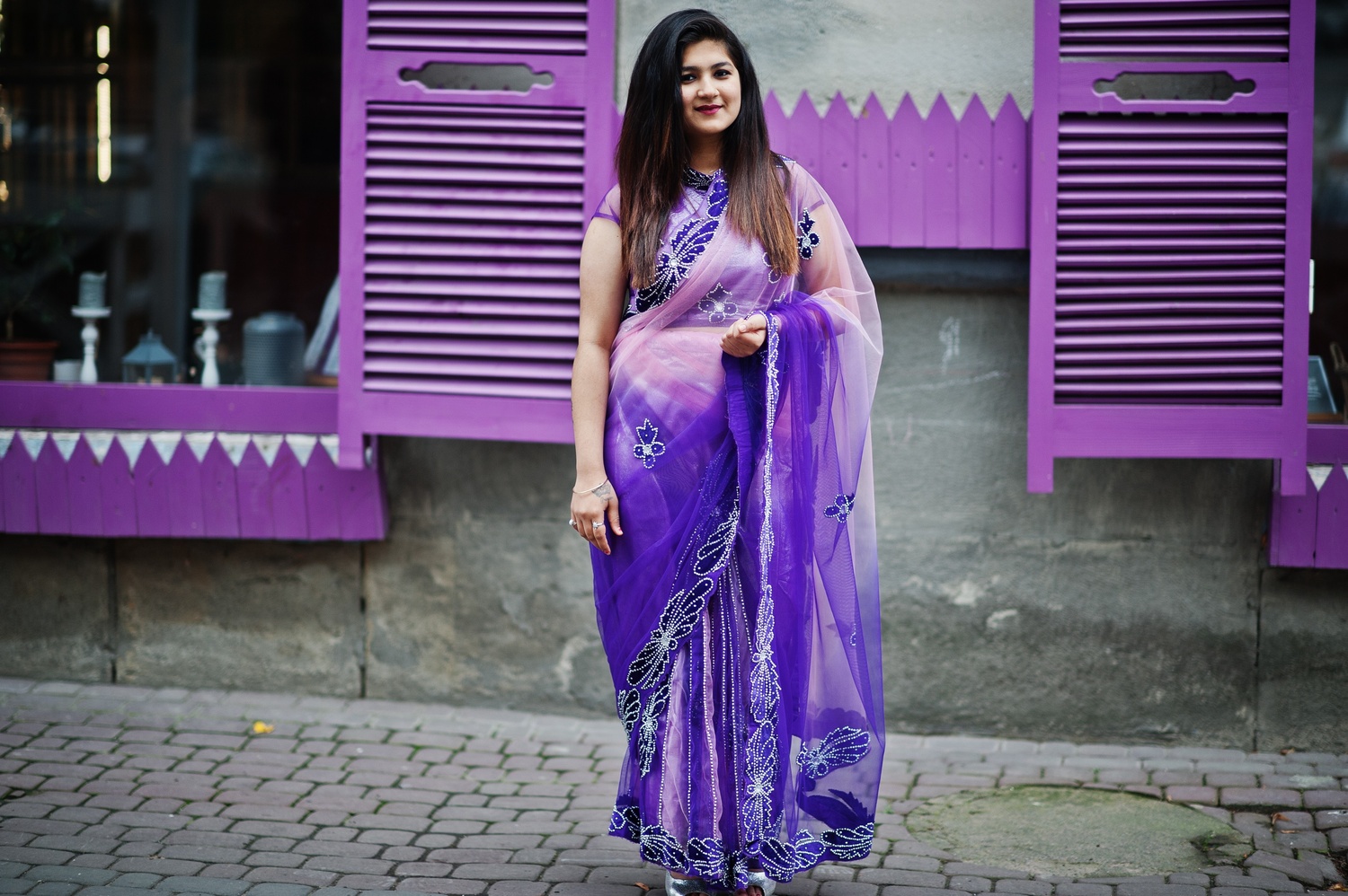 indian-hindu-girl-traditional-violet-saree-posed-street-against-purple-windows-1