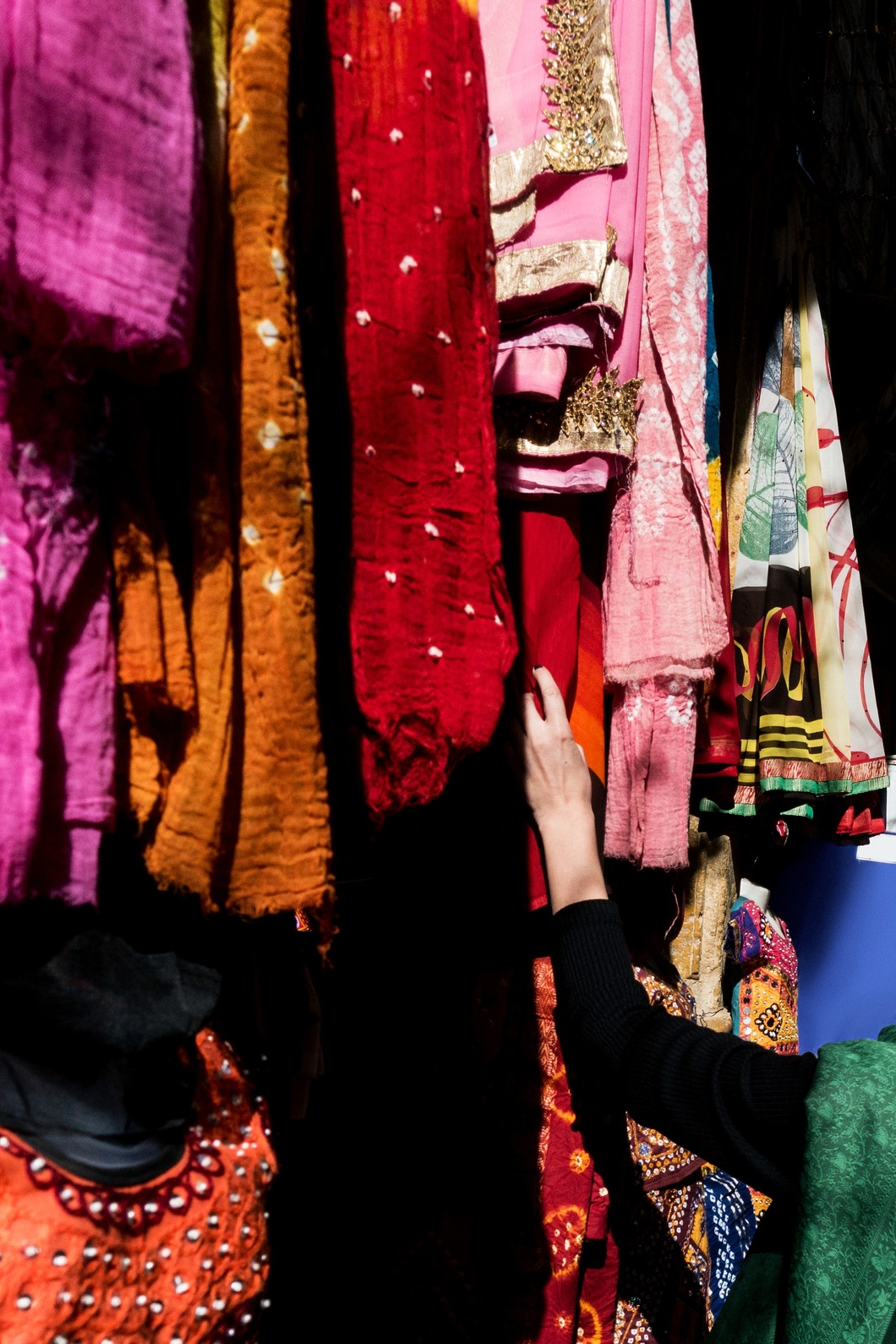 woman-choosing-colorful-sari-market-1